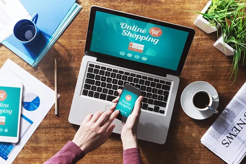 7-reasons-why-you-still-need-a-website Person shopping online with devices