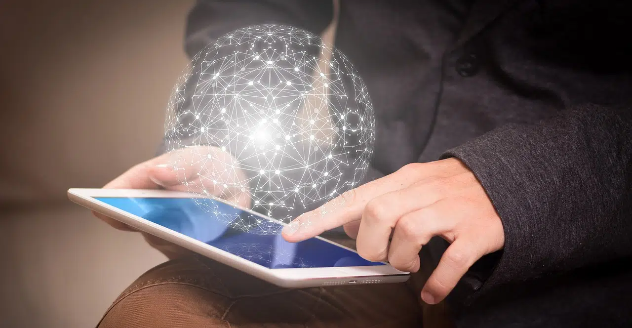 Person using tablet with digital globe