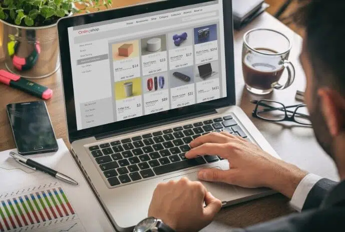 online-shop-website-developer-working-with-a-lapto-2021-08-30-07-27-58-utc-2-1 Person browsing online shop on laptop